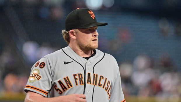 Sep 20, 2023; Phoenix, Arizona, USA; San Francisco Giants starting pitcher Logan Webb (62) looks on at the end of the third inning against the Arizona Diamondbacks at Chase Field. Mandatory Credit: Matt Kartozian-USA TODAY Sports